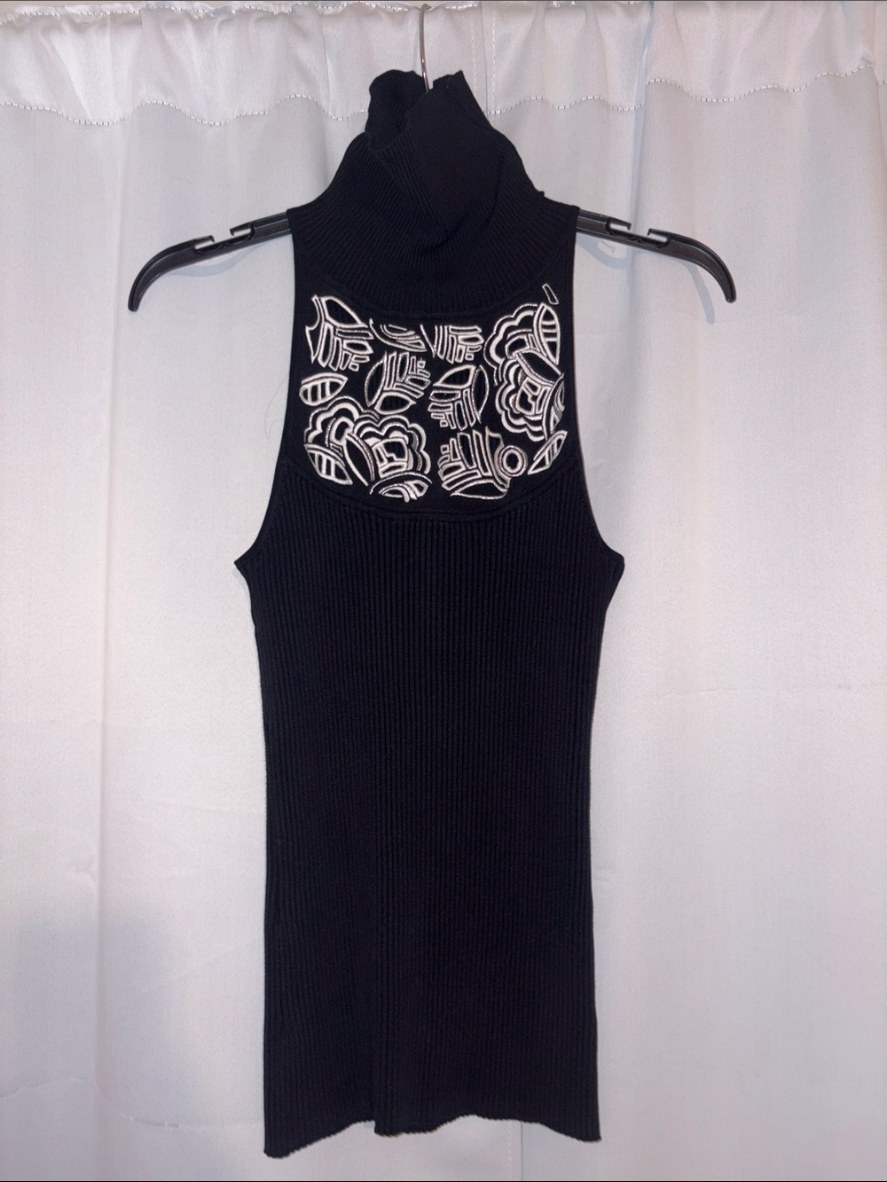 Sleeveless Black Turtleneck Knit Top with White Embroidered Back Detail